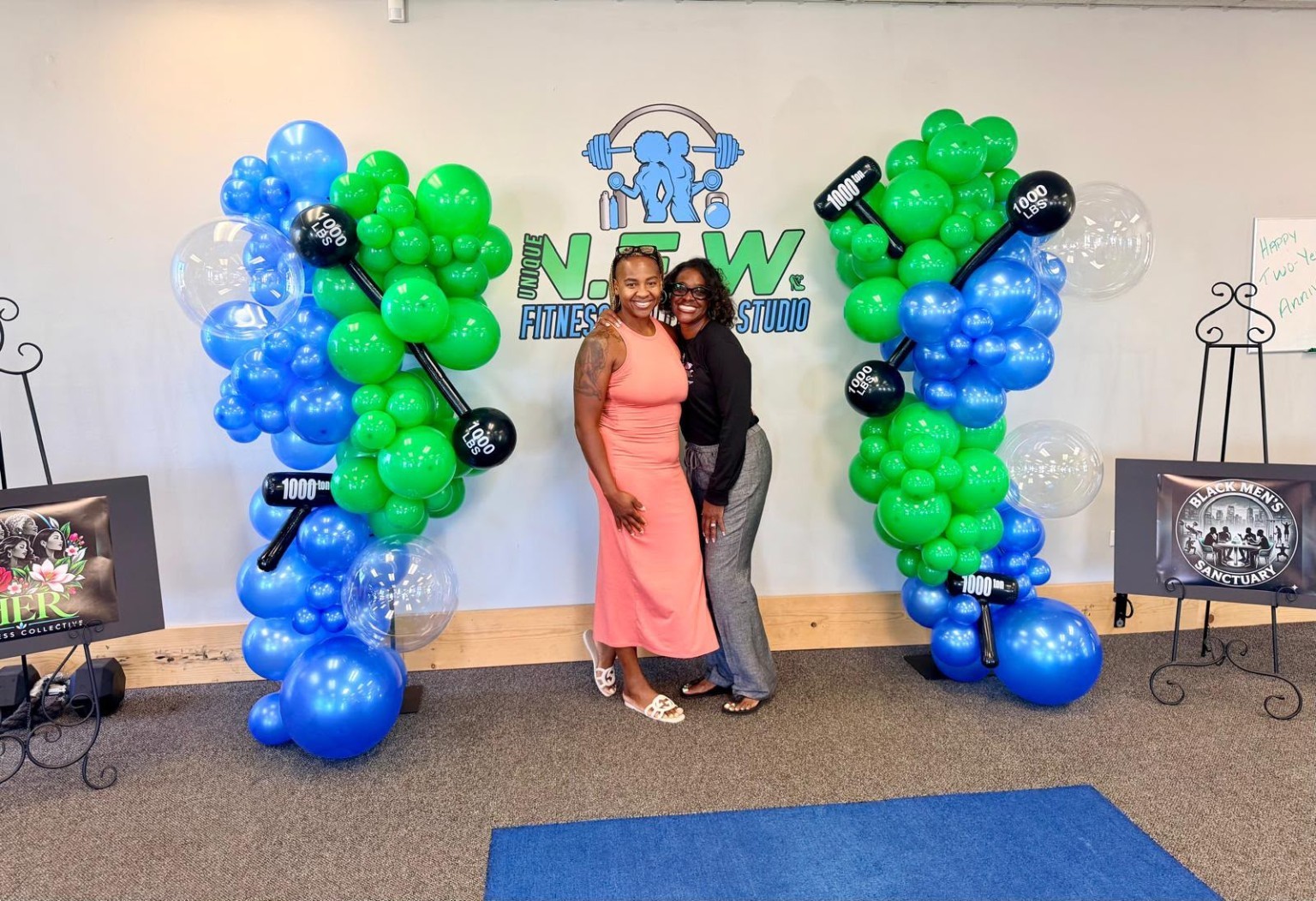 Two guests smiling together at the foundation introduction