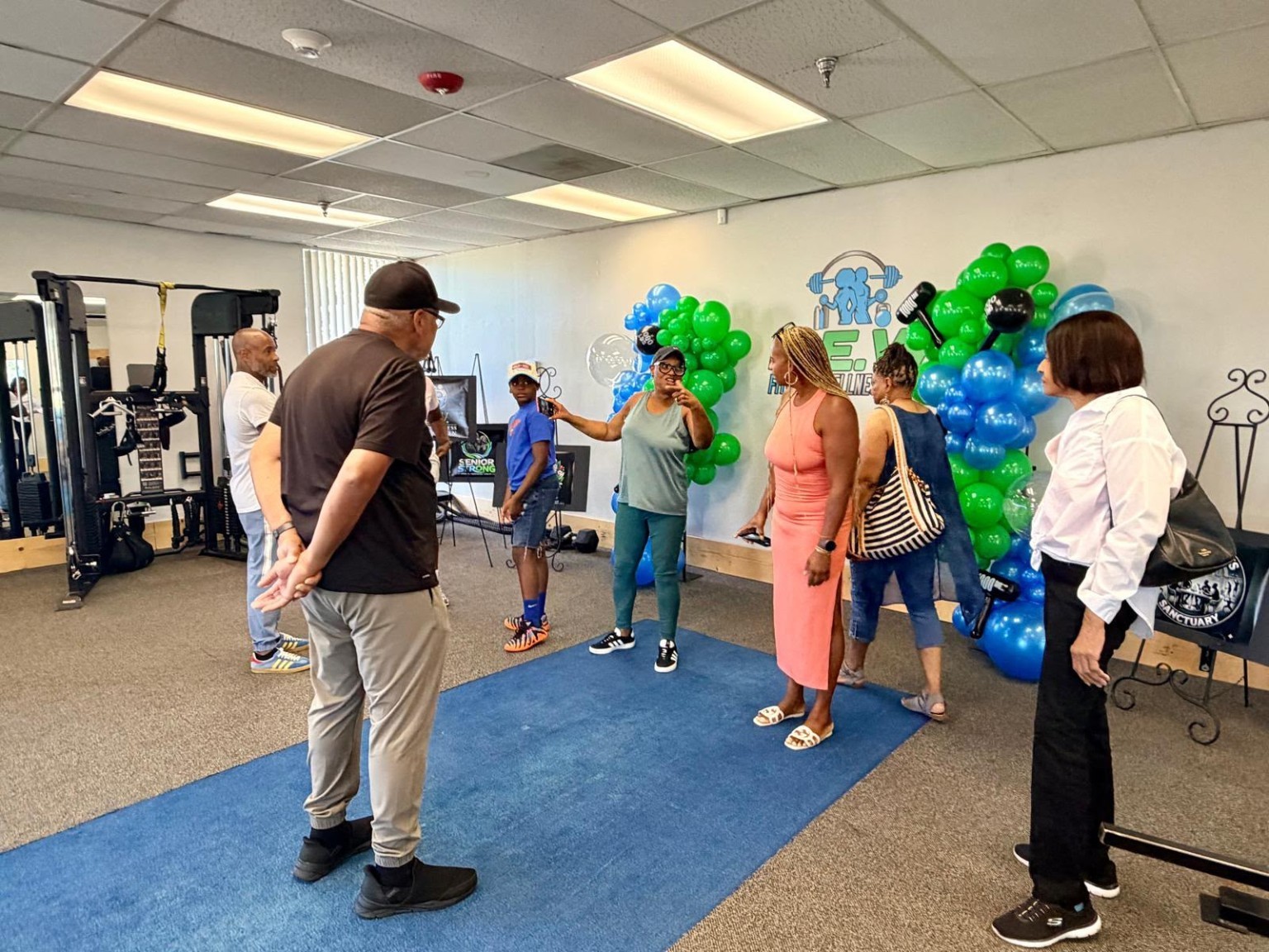 Guests gathered in the studio beside the foundation program displays