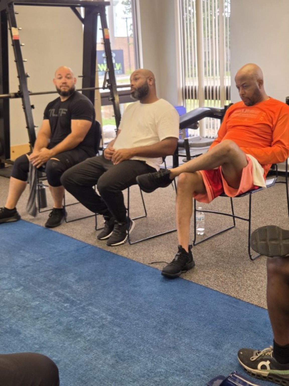 Three men seated together during the Sanctuary gathering
