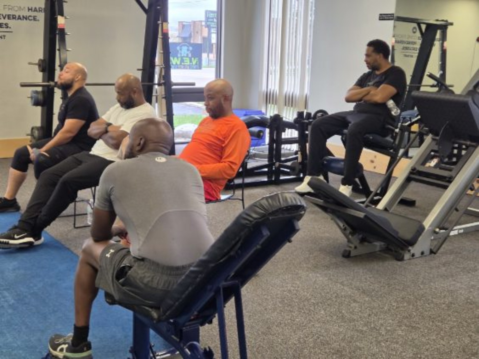 Men listening together in the studio during a Sanctuary gathering